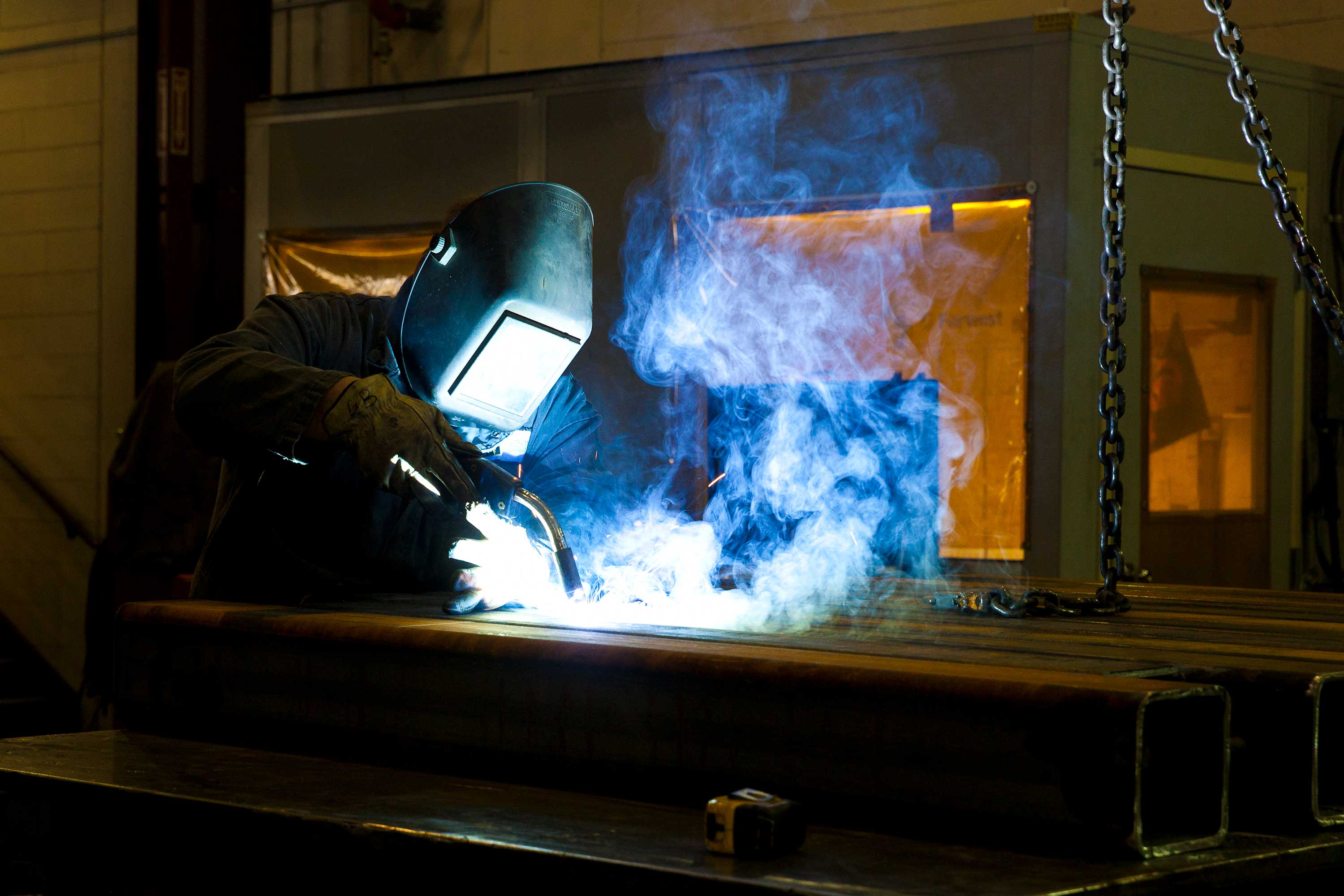 worker welding in shop