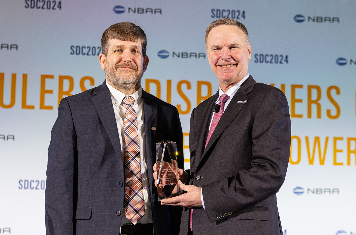 Chris Algee, CAM (left), presented with the Schedulers & Dispatchers (S&D) Outstanding Achievement and Leadership Award by NBAA's Ed Bolen (right)